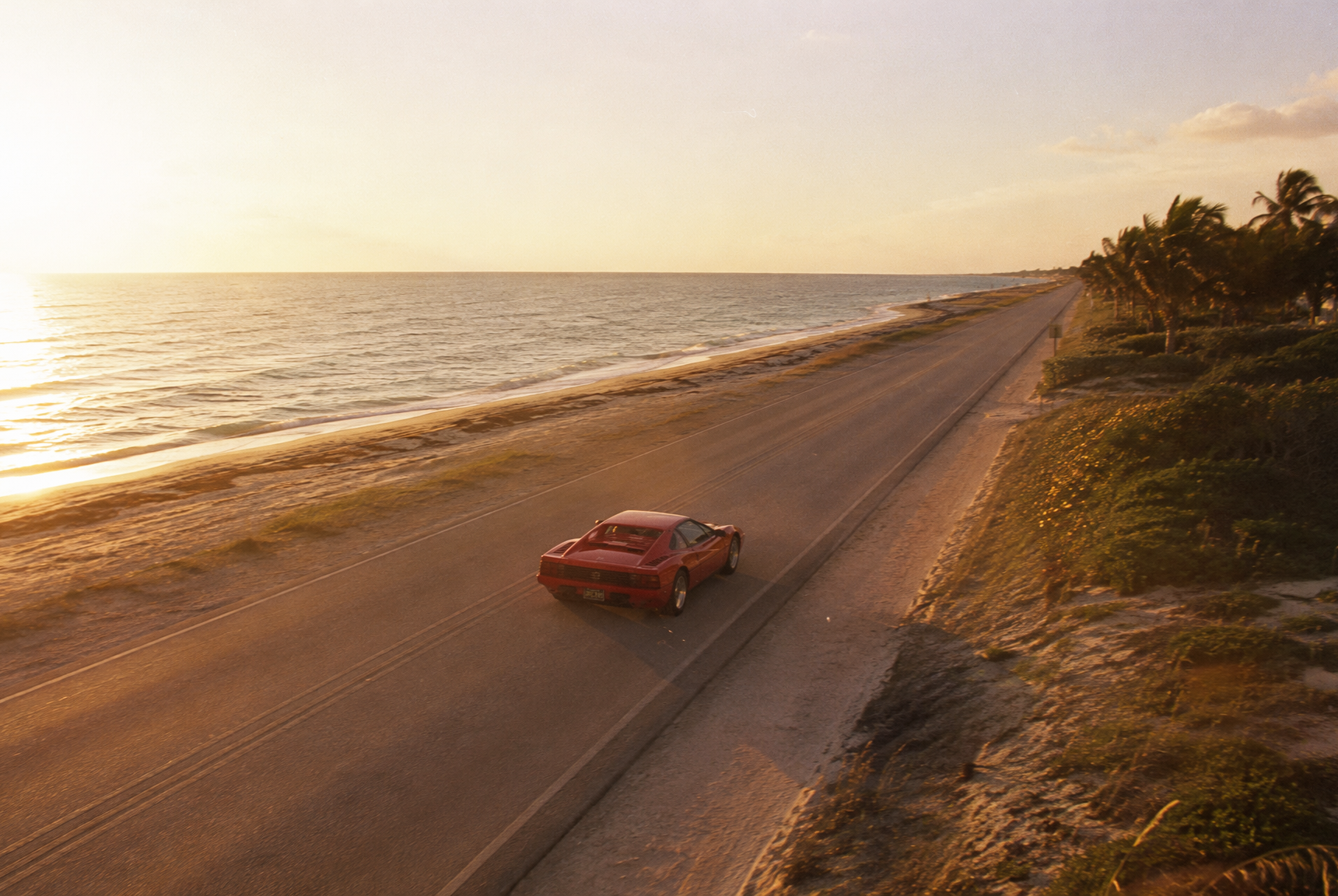 The A1A at golden hour, one red car heading south